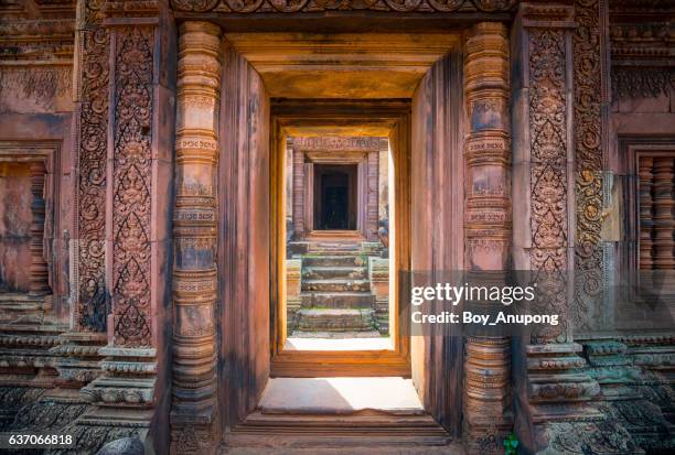 the architecture of banteay srei temple the beautiful pink sandstone of siem reap, cambodia. - empire stock pictures, royalty-free photos & images