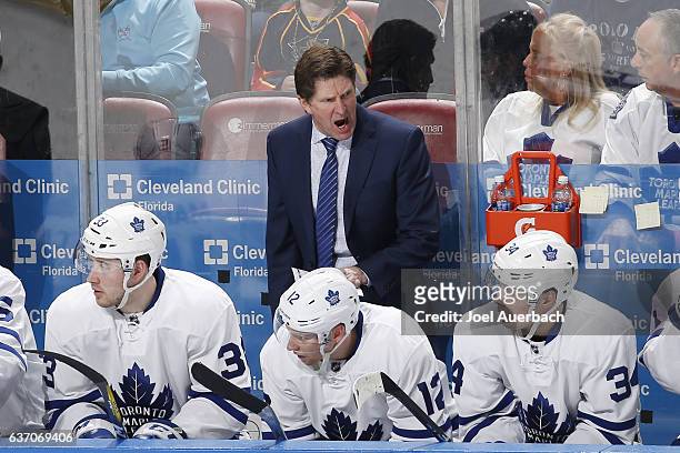 Head Coach Mike Babcock of the Toronto Maple Leafs reacts to third period action against the Florida Panthers at the BB&T Center on December 28, 2016...