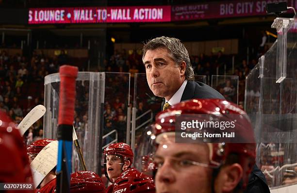 Head coach Dave Tippett of the Arizona Coyotes looks on from the bench against the Dallas Stars at Gila River Arena on December 27, 2016 in Glendale,...