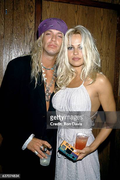 American singer-songwriter and musician Bret Michaels and Canadian-American actress and model Pamela Anderson arrive for "The Hoppening" to benefit...