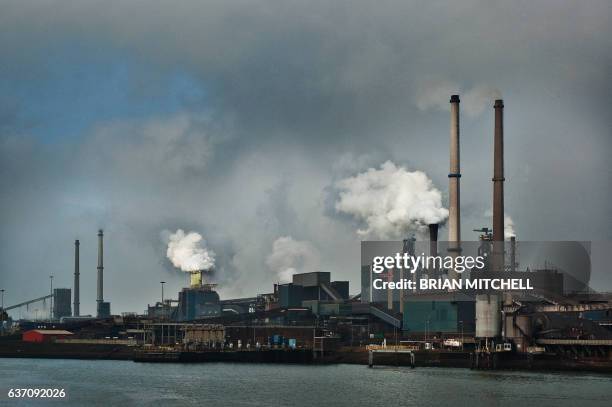 industrial blast furnace emitting plumes of smoke. - blast furnace stock pictures, royalty-free photos & images