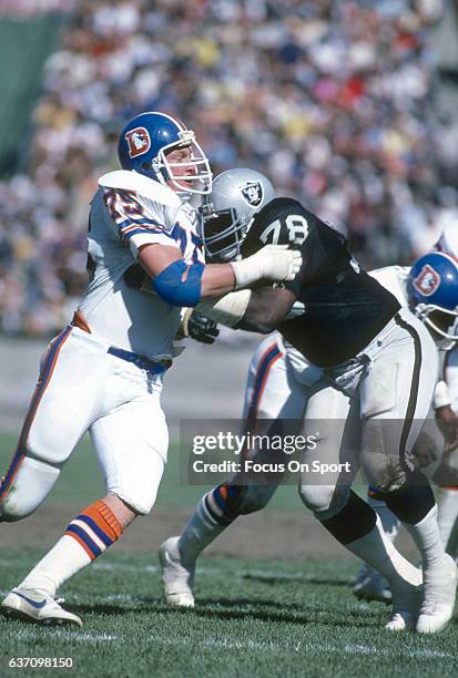 Rulon Jones of the Denver Broncos in action against Art Shell of the Oakland Raiders during an NFL Football game October 4, 1981 at the...