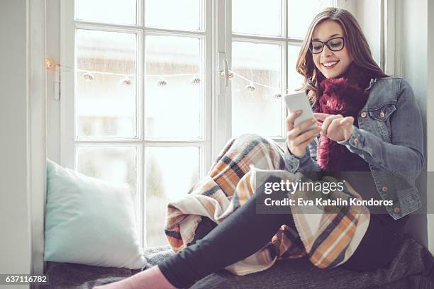 young woman at home - eyeglasses winter stock pictures, royalty-free photos & images