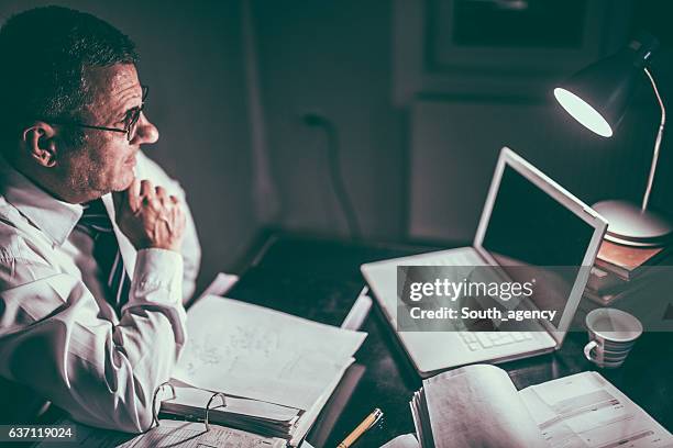 late night working - lonely businessman alone late at work stock pictures, royalty-free photos & images