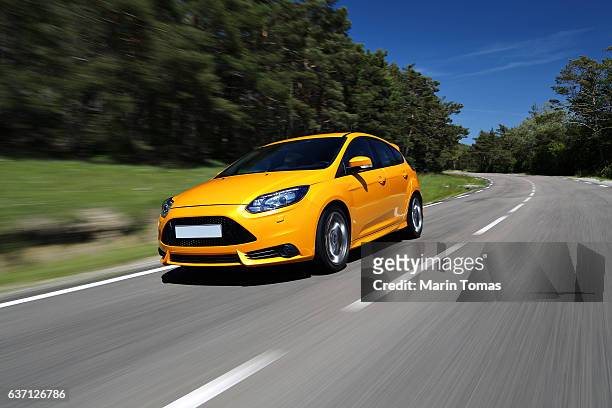 fast car driving - ferrari fotografías e imágenes de stock