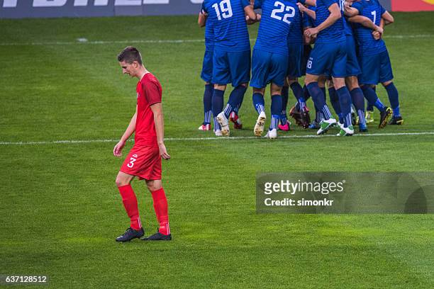 disappointed soccer player - athlete defeat stock pictures, royalty-free photos & images