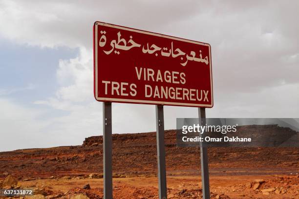 warning sign (arabic/french) - in aménas stock pictures, royalty-free photos & images
