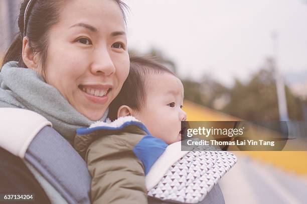 7 months old baby outing with mom - my lai sit stock pictures, royalty-free photos & images