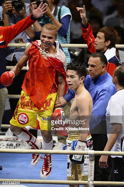 Japan - Champion Amnat Ruenroeng of Thailand celebrates after beating Japan's Kazuto Ioka in an IBF flyweight title match at Osaka's Bodymaker...