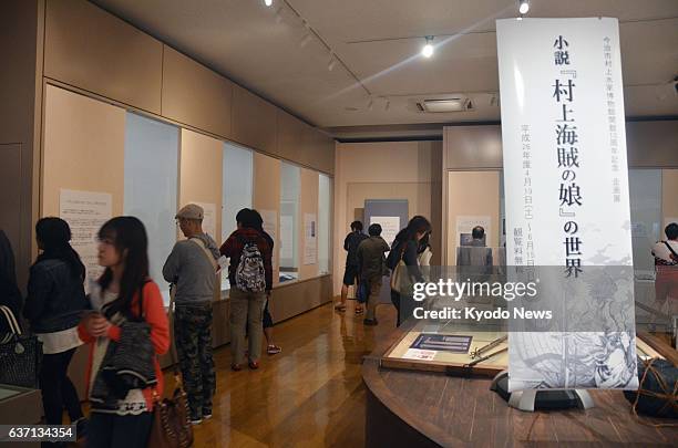 Imabari, Japan - Visitors look at exhibited items at the Murakami Suigun Museum in Imabari, Ehime Prefecture, on May 5, 2014. Some 7,500 people...