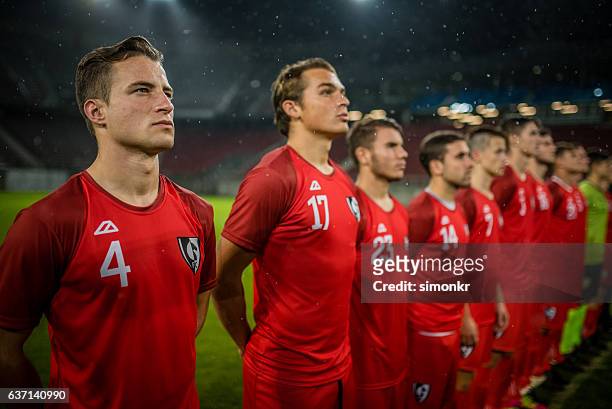 football team in a row - soccer team stock pictures, royalty-free photos & images