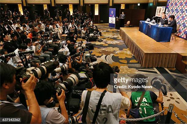Japan - Photo shows journalists covering a press conference by Japan coach Alberto Zaccheroni at a Tokyo hotel on May 12 to announce the members of...