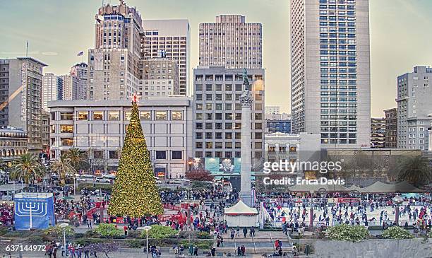 holiday season. people ice skating and enjoying christmas and chanukah festivities. - union square san francisco stock pictures, royalty-free photos & images