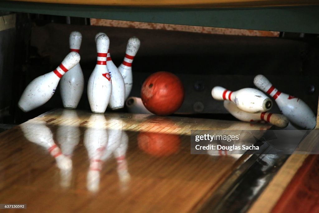 Close up of Bowling Ball hitting the Pins at a Bowling Alley