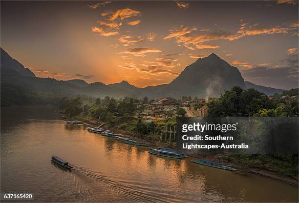 dusk on the nam ou river, nong khiaow, province of luang prabang, laos - laos stock pictures, royalty-free photos & images