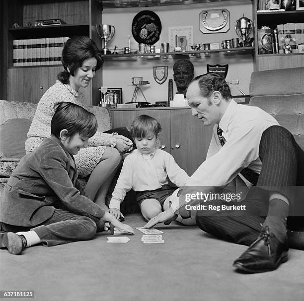 English heavyweight boxer Henry Cooper at home with his wife Albina Genepri and their sons Henry Marco and John Pietro, UK, 17th April 1971.