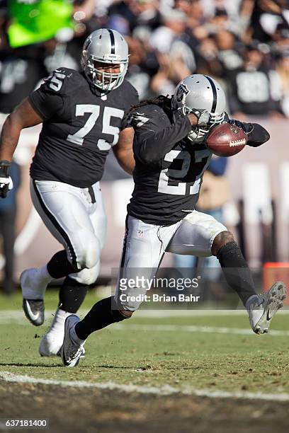 Safety Reggie Nelson of the Oakland Raiders celebrates an interception for a touchback against the Indianapolis Colts in the second quarter on...
