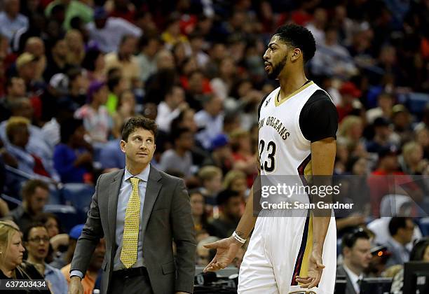 Associate head coach Darren Erman talks with Anthony Davis of the New Orleans Pelicans during the second half of a game against the LA Clippers at...
