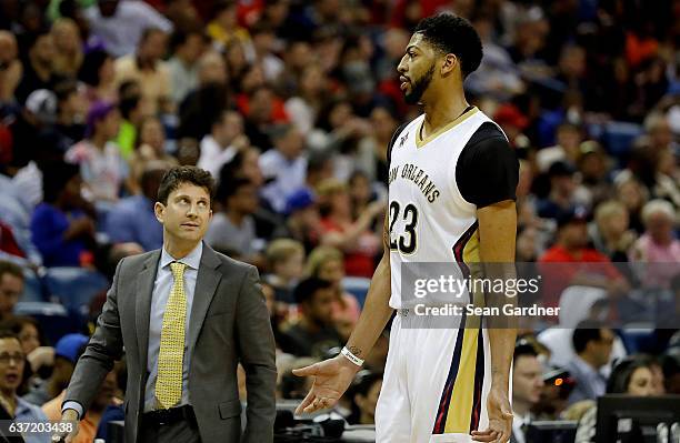 Associate head coach Darren Erman talks with Anthony Davis of the New Orleans Pelicans during the second half of a game against the LA Clippers at...