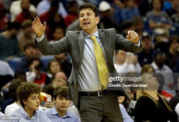 Associate head coach Darren Erman instructs his team during the second half of a game against the LA Clippers at the Smoothie King Center on December...