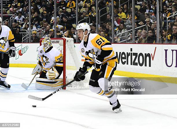 Steven Oleksy of the Pittsburgh Penguins skates with the puck against the Carolina Hurricanes at PPG PAINTS Arena on December 28, 2016 in Pittsburgh,...