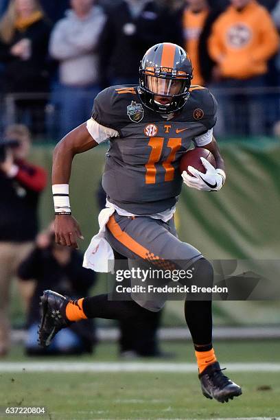 Quarterback Joshua Dobbs of the University of Tennessee Volunteers plays against the Nebraska Cornhuskers during the Franklin American Mortgage Music...