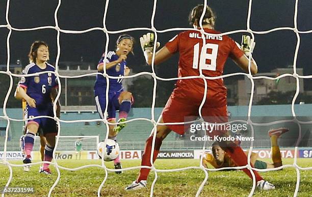 Vietnam - Japan's Yuki Ogimi scores the equalizer against Australia in the second half of their opening Group A game at the Women's Asian Cup in Ho...