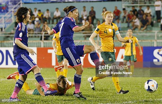 Vietnam - Japan's Yuki Ogimi scores the equalizer against Australia in the second half of their opening Group A game at the Women's Asian Cup in Ho...