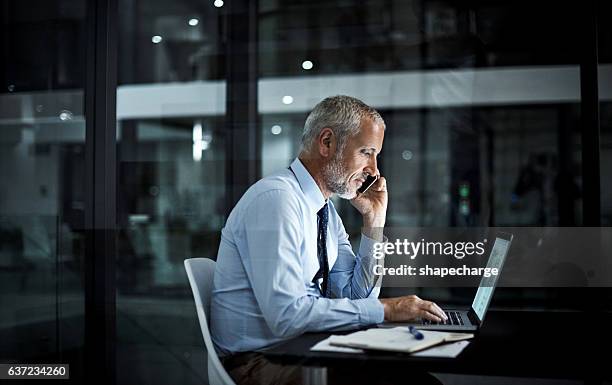to ensure success, you’ve got to work for it - guy looking at computer at night stock pictures, royalty-free photos & images