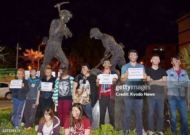 Turkey - Young people gather before the statue of coal miners in Soma, western Turkey, on May 14 to protest a recent local coal mine accident.