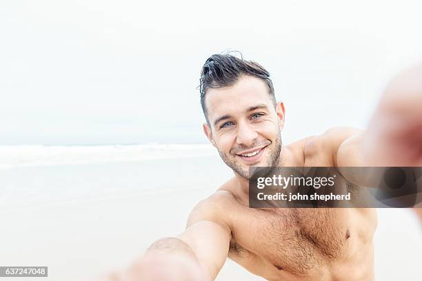 pov selfie of a handsome man at the beach. - hairy body stock pictures, royalty-free photos & images