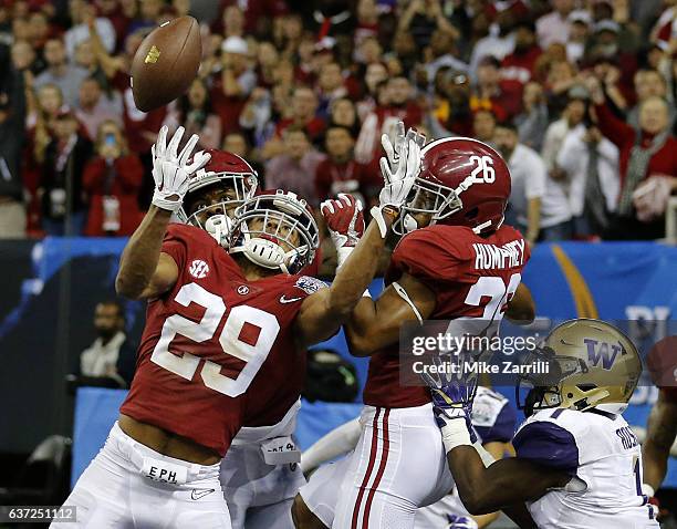 Defensive back Minkah Fitzpatrick of the Alabama Crimson Tide intercepts a pass in the fourth quarter in the 2016 CFP semifinal at the Peach Bowl at...