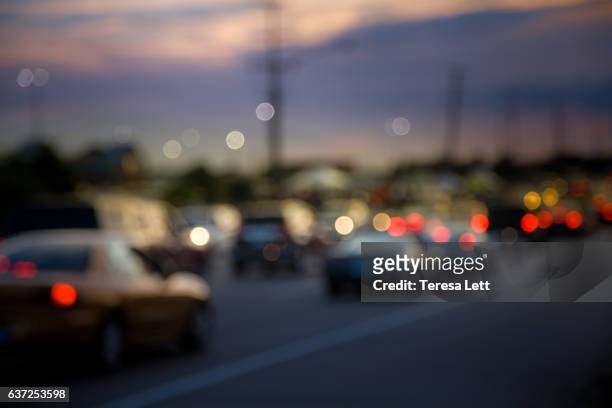 heavy traffic at sunset - red car wire stock pictures, royalty-free photos & images