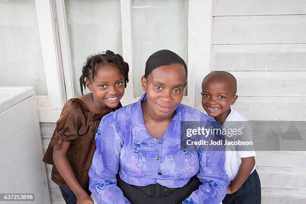 series:proud honduran aunt with her young niece and nephew - chubby girls stock pictures, royalty-free photos & images