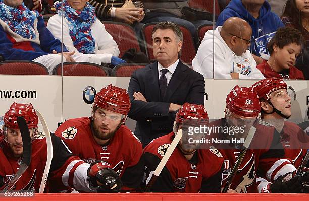 Head coach Dave Tippett, Martin Hanzal and Jordan Martinook of the Arizona Coyotes looks on from the bench against the New York Rangers at Gila River...