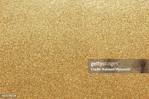 gold glitter paper texture background - gold leaf stock pictures, royalty-free photos & images