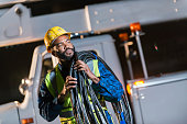 African American man with cherry picker truck