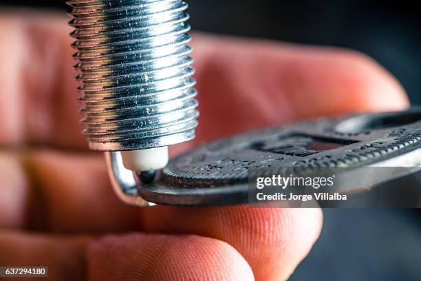 car spark plug meassuring gap with tool - spark plug stock pictures, royalty-free photos & images