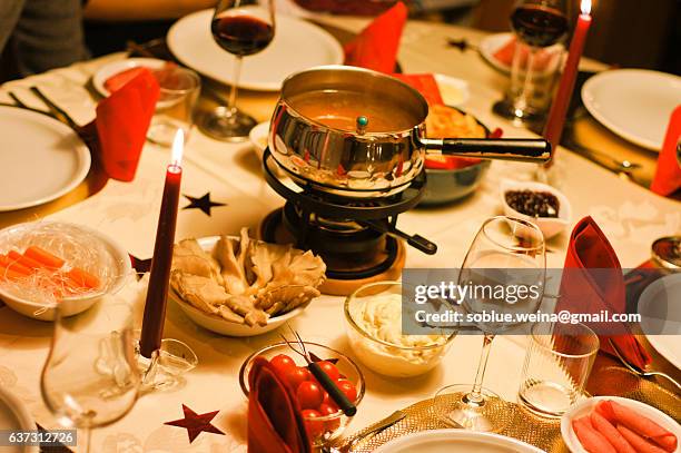 christmas in glr swiss fondue dinner christmas eve and new years eve - valais canton stock pictures, royalty-free photos & images