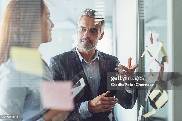 business strategy - executive board meeting stock pictures, royalty-free photos & images