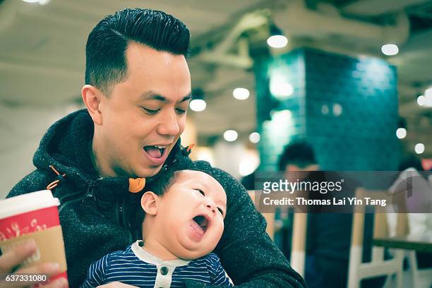 7 months old baby at coffee shop - my lai sit stock pictures, royalty-free photos & images