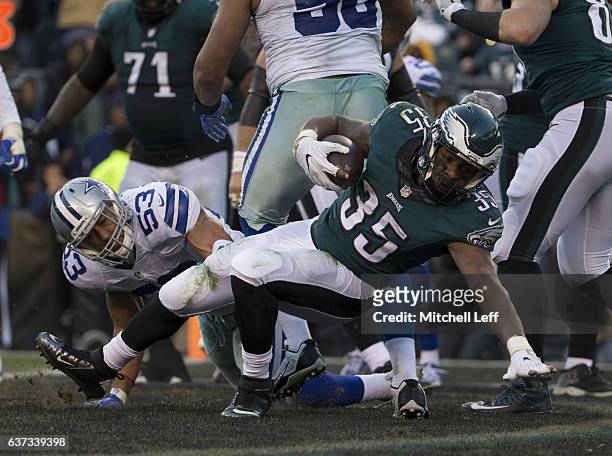 Terrell Watson of the Philadelphia Eagles runs past Mark Nzeocha of the Dallas Cowboys to score a touchdown in the fourth quarter at Lincoln...