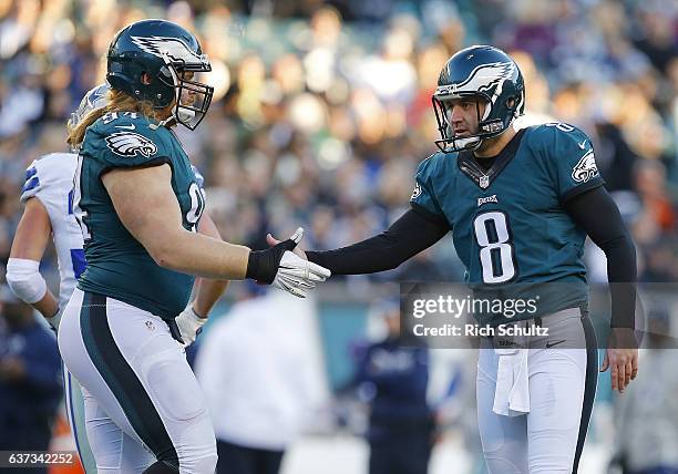 Donnie Jones of the Philadelphia Eagles is congratulated by Beau Allen against the Dallas Cowboys during the fourth quarter of a game at Lincoln...