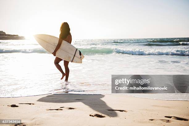 young female surfer - bondi beach sand stock pictures, royalty-free photos & images