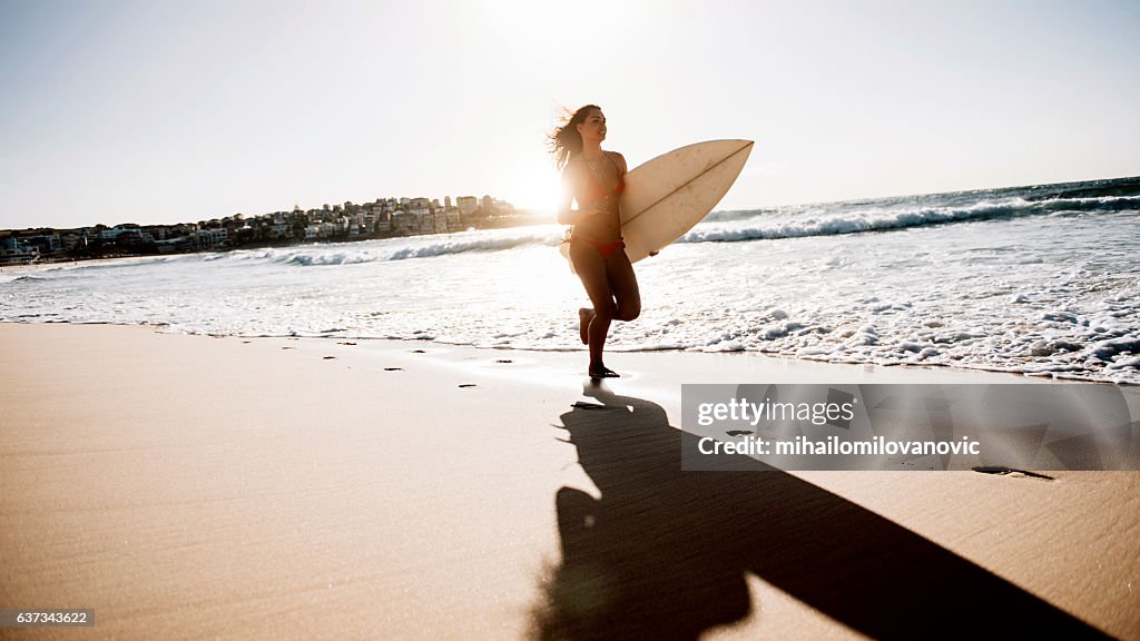 Young woman going for a surf