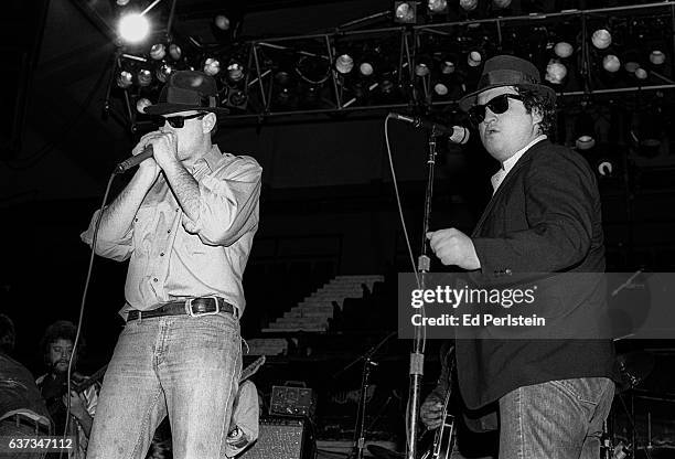 Dan Aykroyd and John Belushi perform during rehearsal for a Blues Brothers concert at Winterland Arena on December 31, 1978 in San Francisco,...