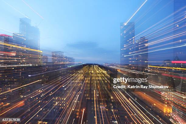 astro projection. light speed of modern cityscapes - heranzoomen stock-fotos und bilder