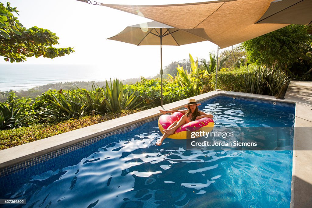 A woman relaxing in a private pool.