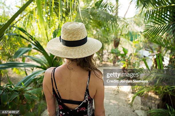 a woman in a beach hat. - nosara costa rica stock pictures, royalty-free photos & images