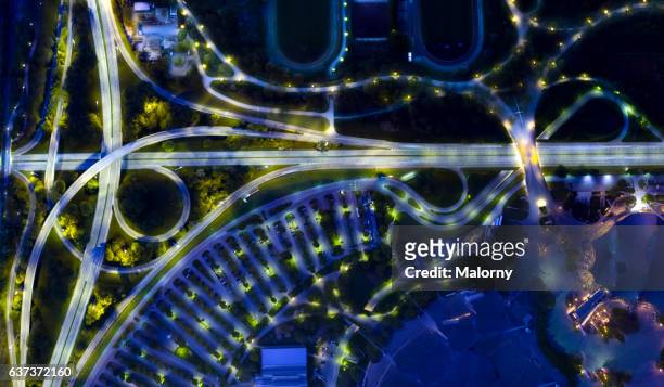 city of the future at night. top view, view from above, aerial view - munich stock-fotos und bilder